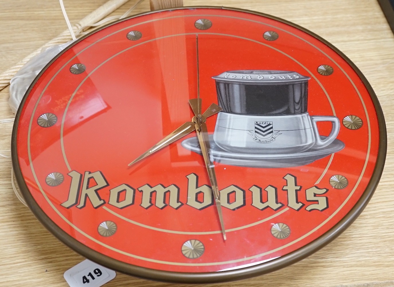 A 1970's Rombouts advertising wall clock, 40cms diameter